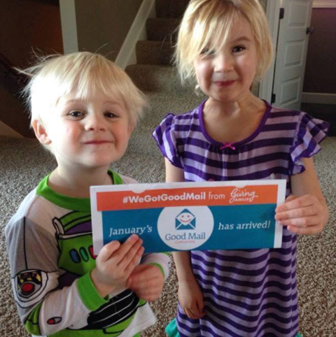 Children holding Good Mail